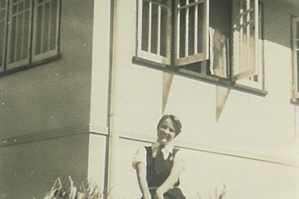 1956 Gloria Omodei outside Lower building